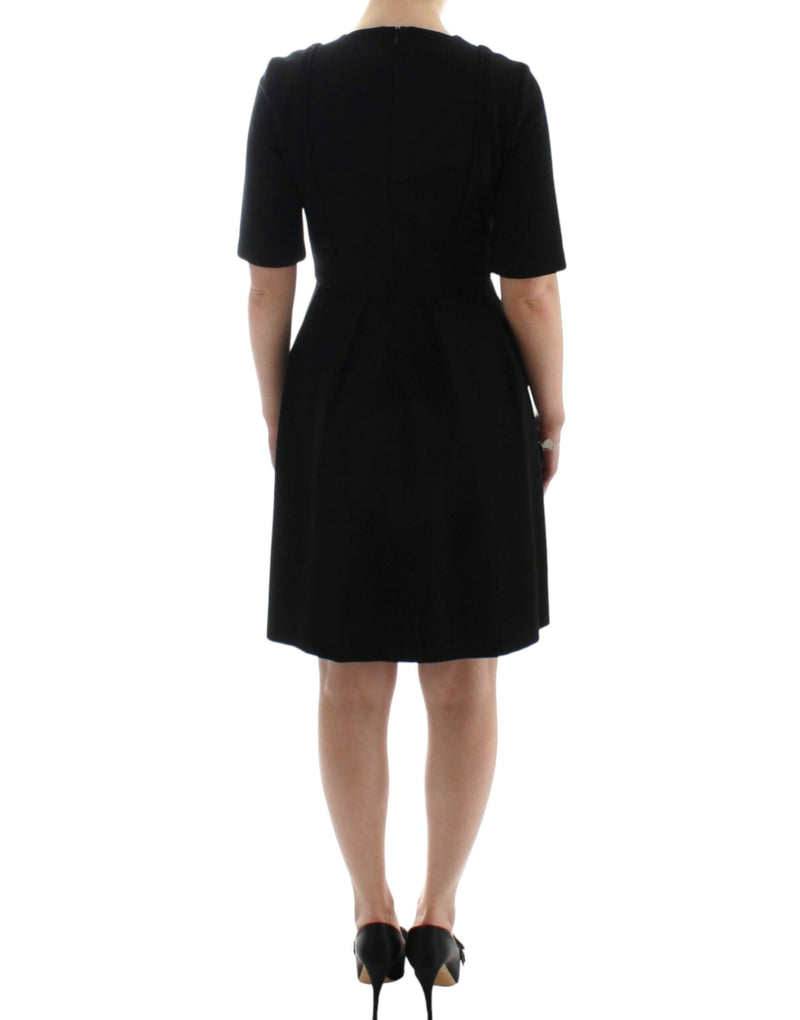 CO|TE Robe Venus noire à manches courtes