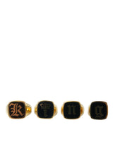 Dolce & Gabbana Lot de 4 bagues en laiton doré et émail KING