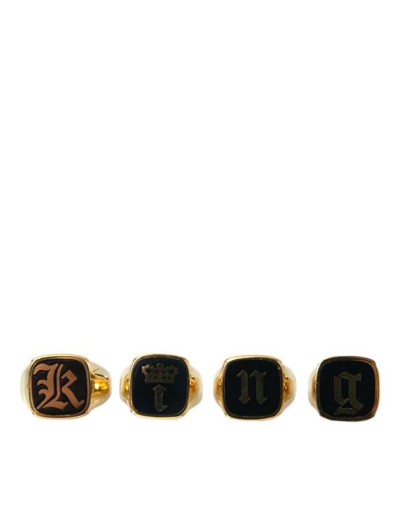Dolce & Gabbana Lot de 4 bagues en laiton doré et émail KING