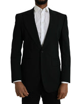 Dolce &amp; Gabbana, blazer noir en laine à revers, à simple boutonnage.