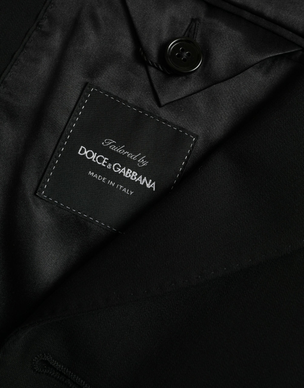 Dolce &amp; Gabbana, blazer noir en laine à revers, à simple boutonnage.