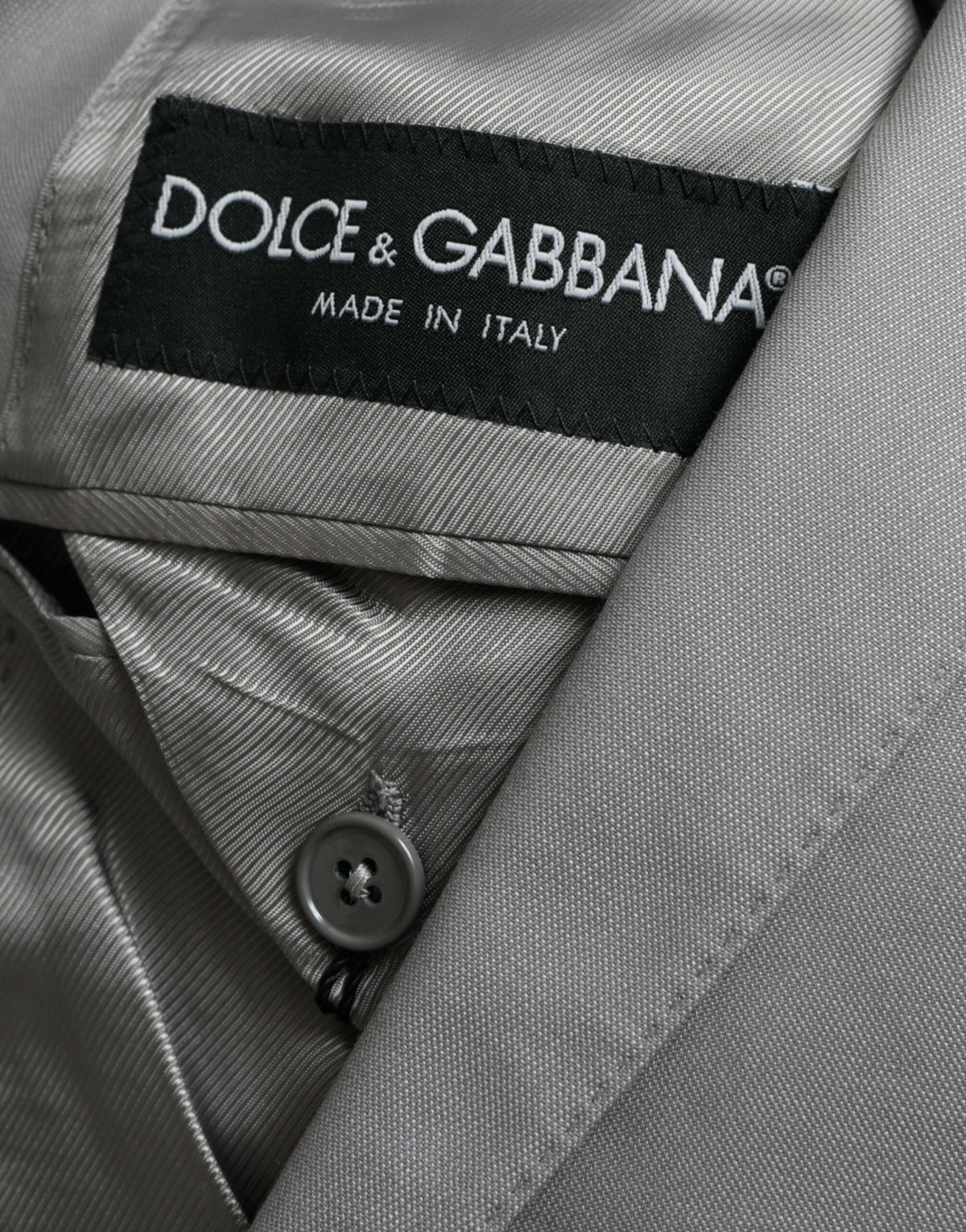 Dolce &amp; Gabbana, veste-blazer grise en laine à revers, à simple boutonnage.