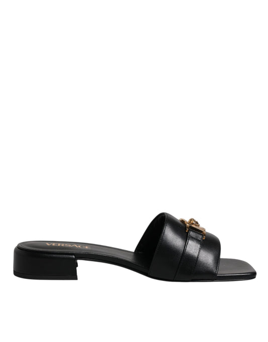 Zwarte leren slippers met logo-plaatje van Versace