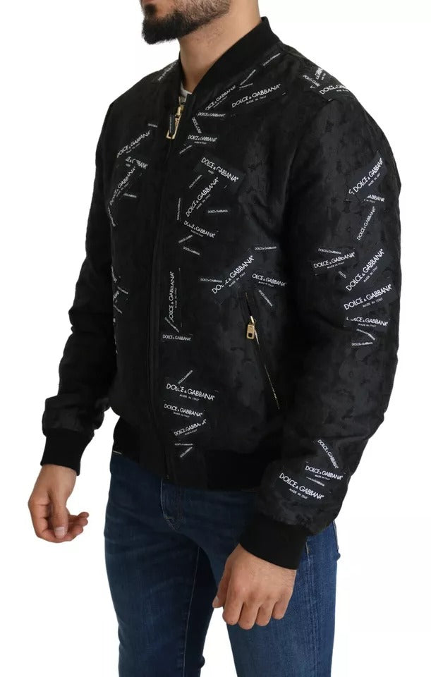 Veste bomber à fermeture éclair intégrale en brocart noir avec logo Dolce & Gabbana.