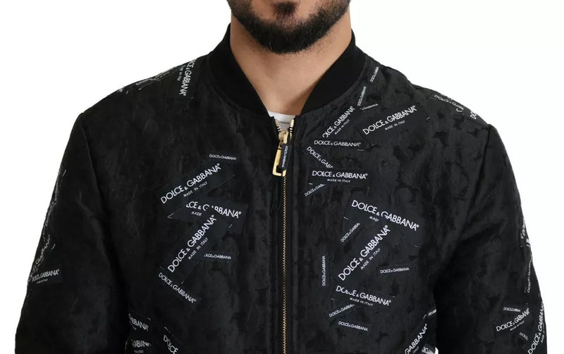 Veste bomber à fermeture éclair intégrale en brocart noir avec logo Dolce & Gabbana.