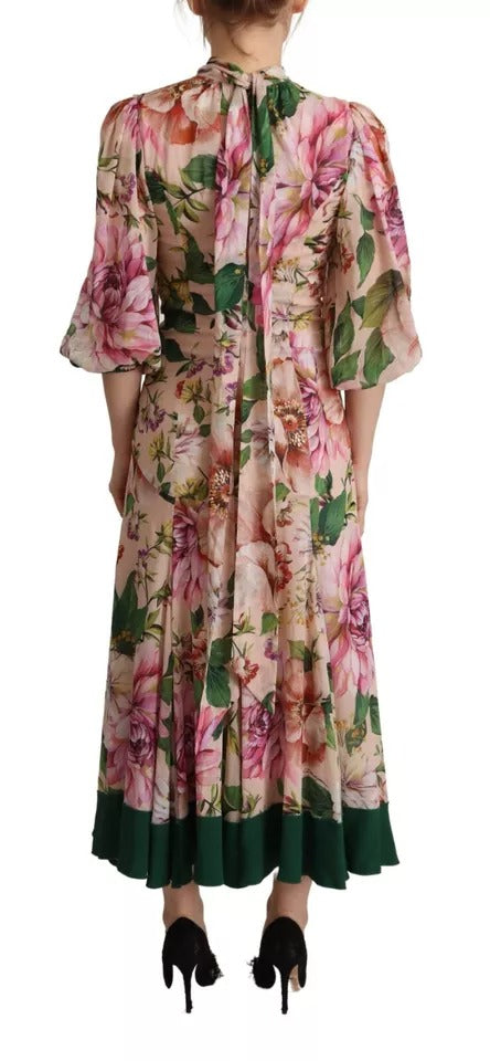 Robe longue rose, style fourreau, à ligne A, à motif floral et nœud en satin de Dolce & Gabbana.