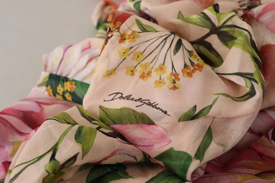 Robe longue rose, style fourreau, à ligne A, à motif floral et nœud en satin de Dolce & Gabbana.