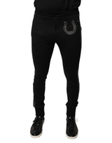 Pantalon slim en laine noir à ornements en forme de fer à cheval de Dolce &amp; Gabbana