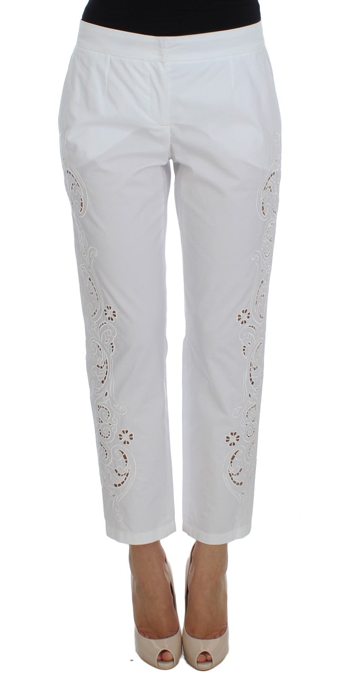 Robe blanche à motifs floraux et découpes Dolce &amp; Gabbana, pantalon Sicily.
