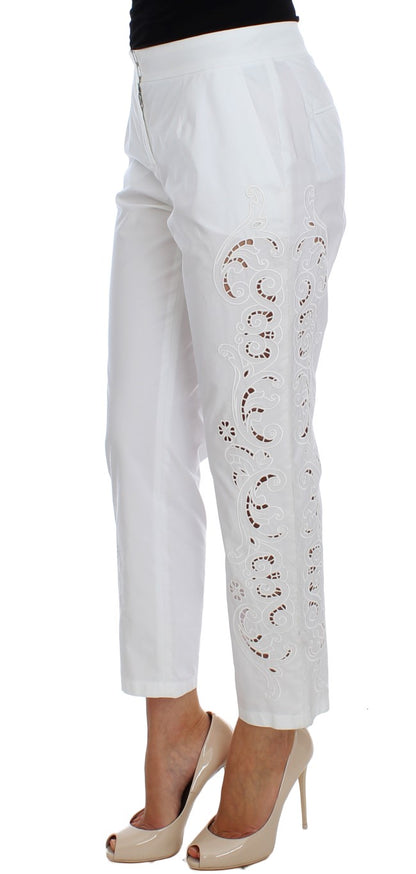 Robe blanche à motifs floraux et découpes Dolce & Gabbana, pantalon Sicily.