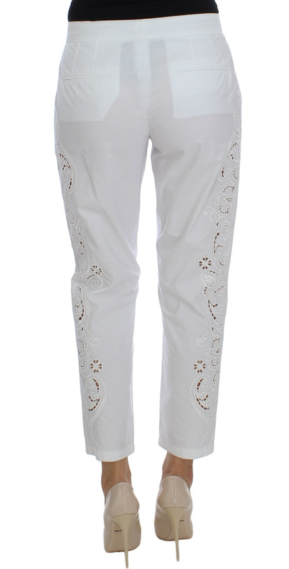 Robe blanche à motifs floraux et découpes Dolce & Gabbana, pantalon Sicily.