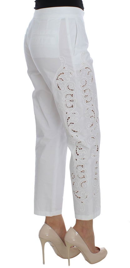 Robe blanche à motifs floraux et découpes Dolce & Gabbana, pantalon Sicily.