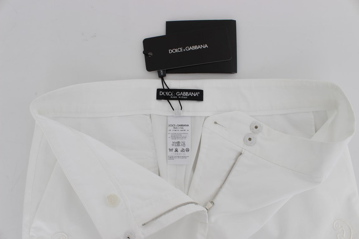 Robe blanche à motifs floraux et découpes Dolce &amp; Gabbana, pantalon Sicily.