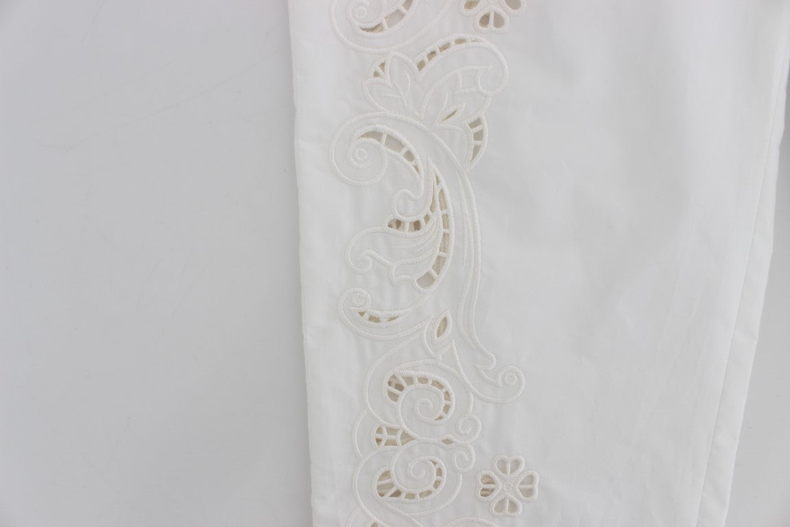 Robe blanche à motifs floraux et découpes Dolce & Gabbana, pantalon Sicily.