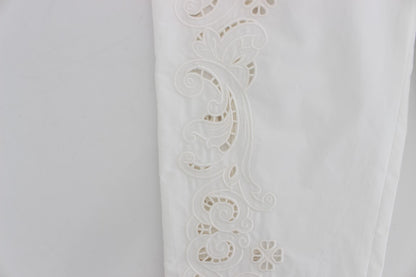 Robe blanche à motifs floraux et découpes Dolce & Gabbana, pantalon Sicily.