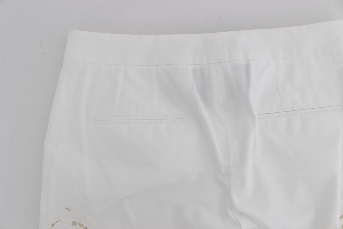 Robe blanche à motifs floraux et découpes Dolce & Gabbana, pantalon Sicily.