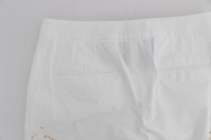 Robe blanche à motifs floraux et découpes Dolce & Gabbana, pantalon Sicily.
