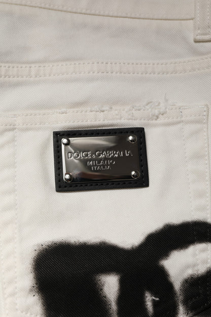 Jeans skinny en jean blanc délavé et dépareillé avec graffitis de Dolce & Gabbana