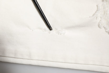 Jeans skinny en jean blanc délavé et dépareillé avec graffitis de Dolce & Gabbana