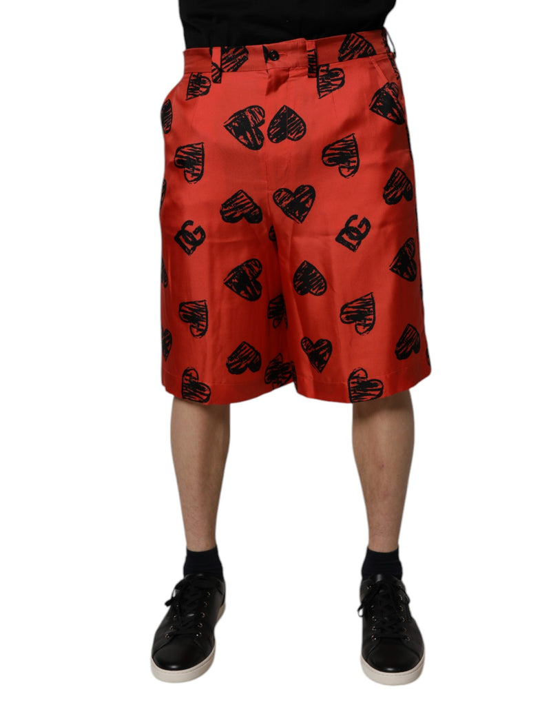 Dolce &amp; Gabbana Bermuda shorts van oranje zijde met hartjesprint