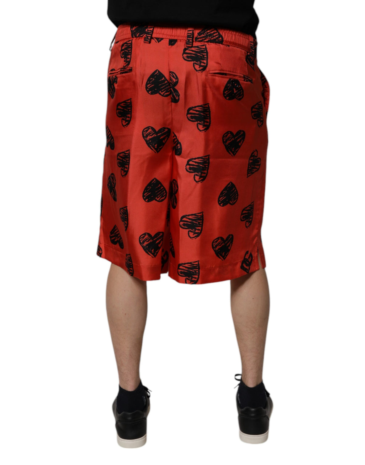 Shorts Bermuda en soie orange à imprimé cœur de Dolce &amp; Gabbana