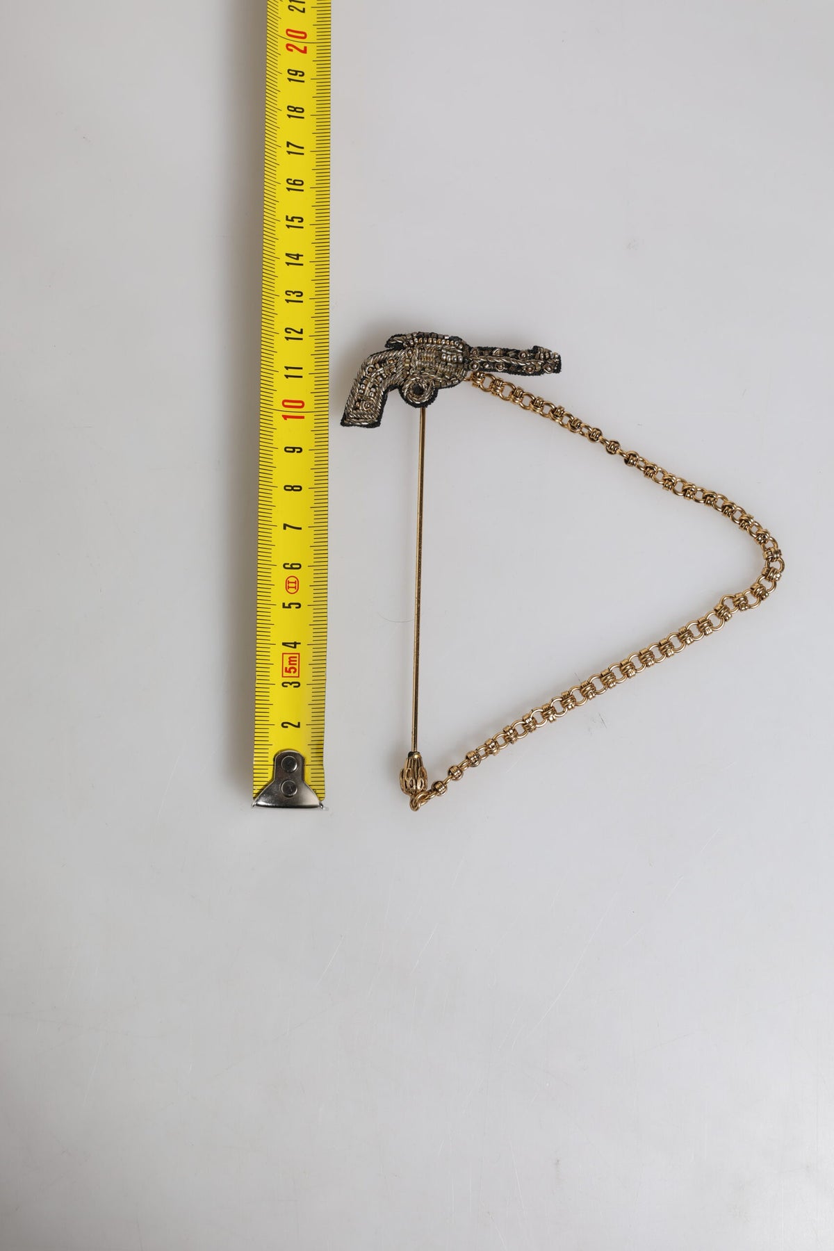 Broche revolver Dolce & Gabbana en laiton doré noir et cuivre