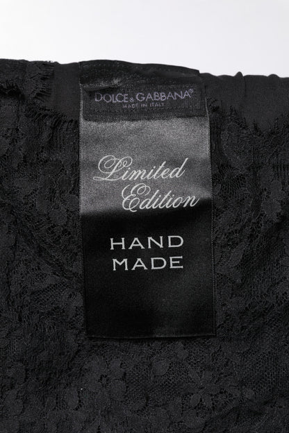 Dolce & Gabbana zwart kantengebreide, doorschijnende top met ronde hals en het heilige hart als motief.