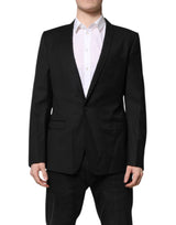 Dolce &amp; Gabbana, veste-blazer noire à simple boutonnage, ornée de détails dorés.