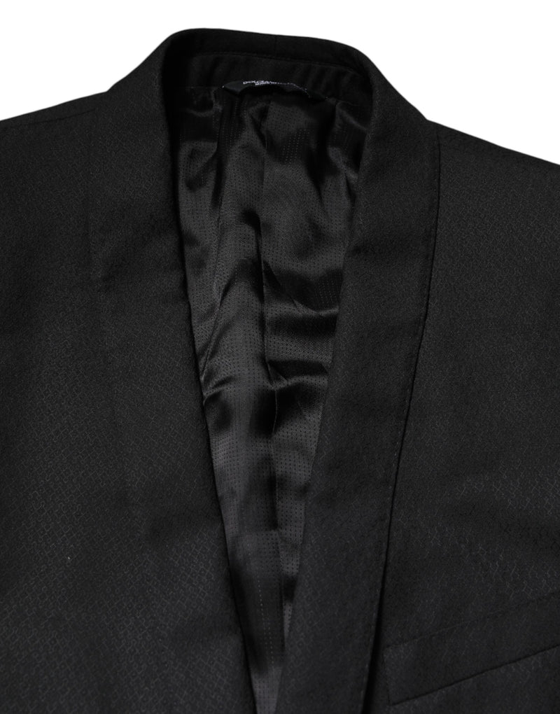 Dolce &amp; Gabbana, veste-blazer noire à simple boutonnage, ornée de détails dorés.