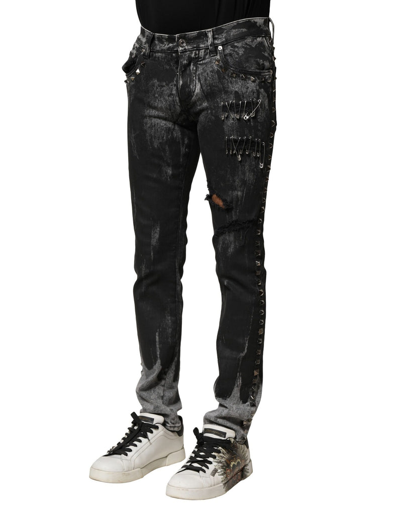 Jeans skinny en jean noir délavé et ornés de strass de Dolce &amp; Gabbana