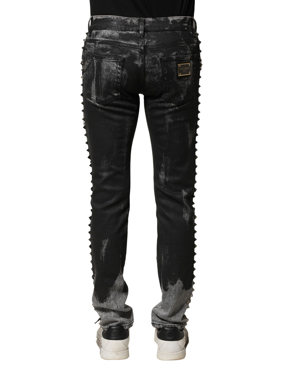 Jeans skinny en jean noir délavé et ornés de strass de Dolce &amp; Gabbana