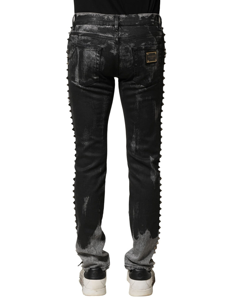 Jeans skinny en jean noir délavé et ornés de strass de Dolce &amp; Gabbana