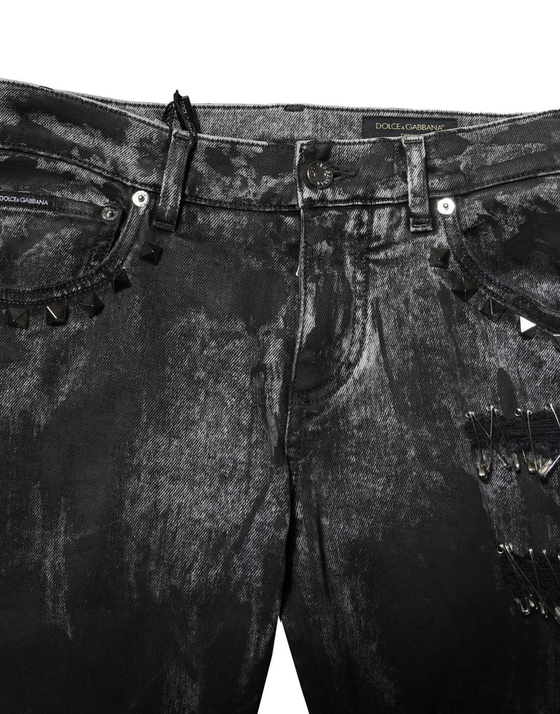 Jeans skinny en jean noir délavé et ornés de strass de Dolce &amp; Gabbana
