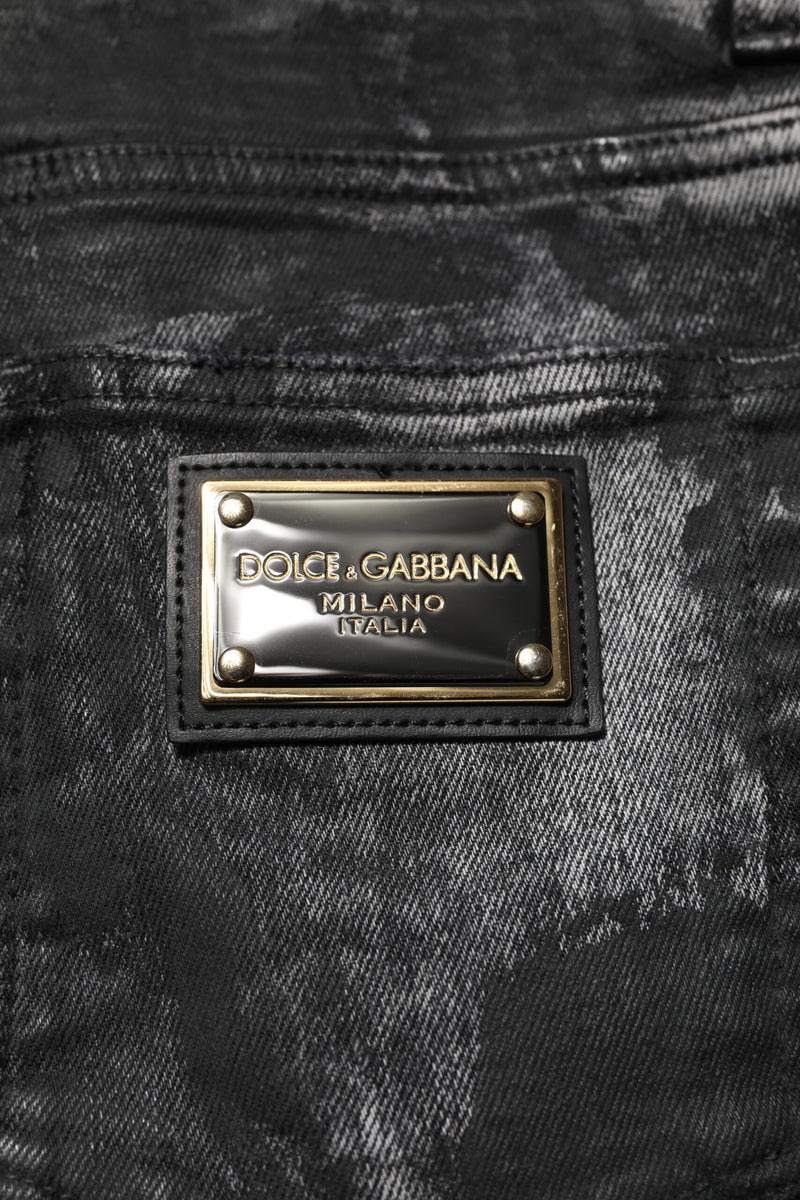 Jeans skinny en jean noir délavé et ornés de strass de Dolce &amp; Gabbana