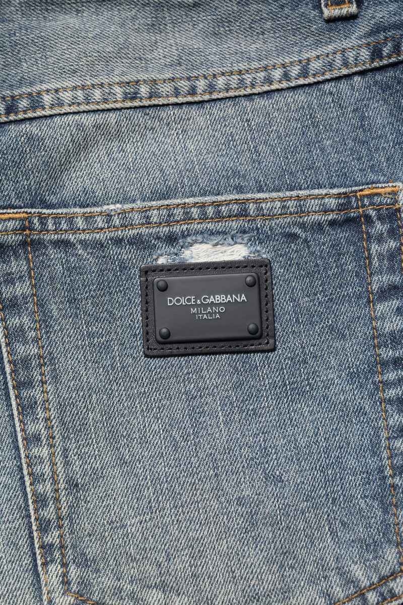 Jean droit en jean délavé et déchiré bleu de Dolce &amp; Gabbana
