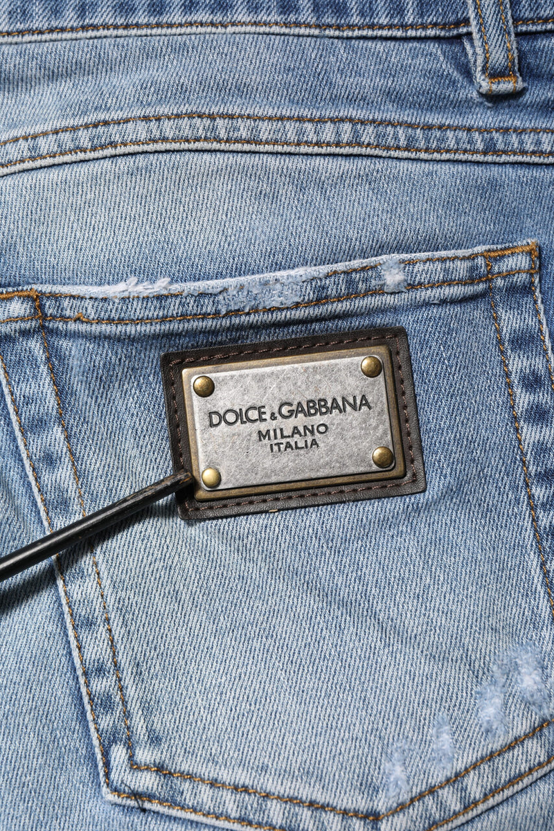 Jeans en jean bleu délavé et déchiré avec plaque logo Dolce &amp; Gabbana