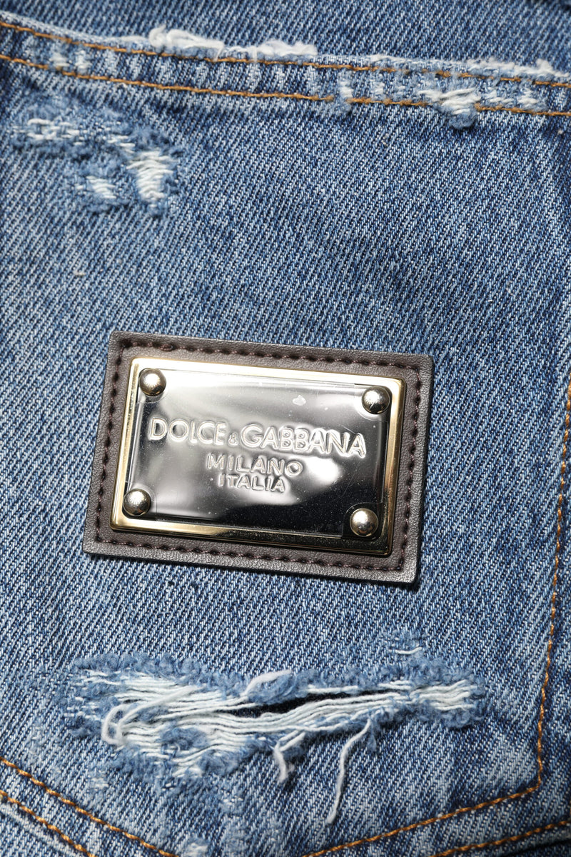 Jeans en jean bleu déchiré Dolce &amp; Gabbana avec plaque de logo en coton