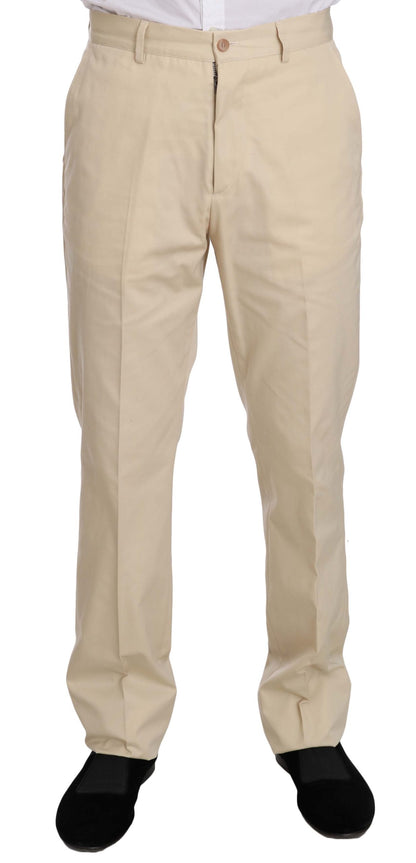 Costume deux pièces en coton beige uni, à trois boutons, de Romeo Gigli.