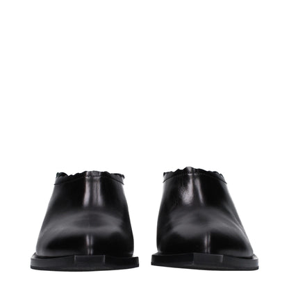 Moschino leren slippers in zwart