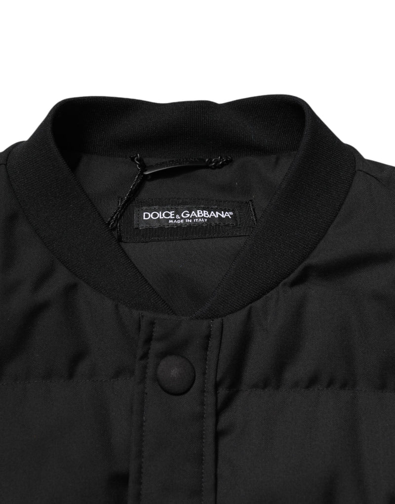 Veste-parka noire sans manches Dolce & Gabbana avec plaque de logo.