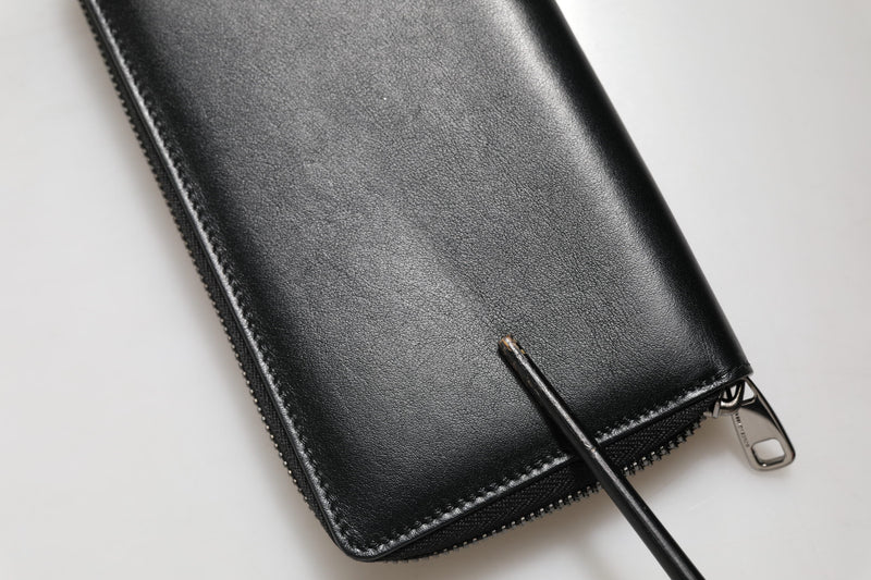 Portefeuille continental zippé en cuir noir Dolce &amp; Gabbana avec plaque DG
