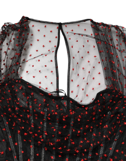 Mini-robe noire à manches longues et garniture en dentelle de Dolce & Gabbana