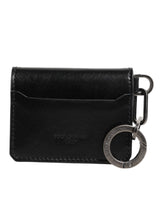 Portefeuille en cuir noir Dolce &amp; Gabbana avec logo en relief, porte-clés et porte-cartes.