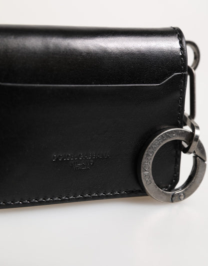 Portefeuille en cuir noir Dolce & Gabbana avec logo en relief, porte-clés et porte-cartes.