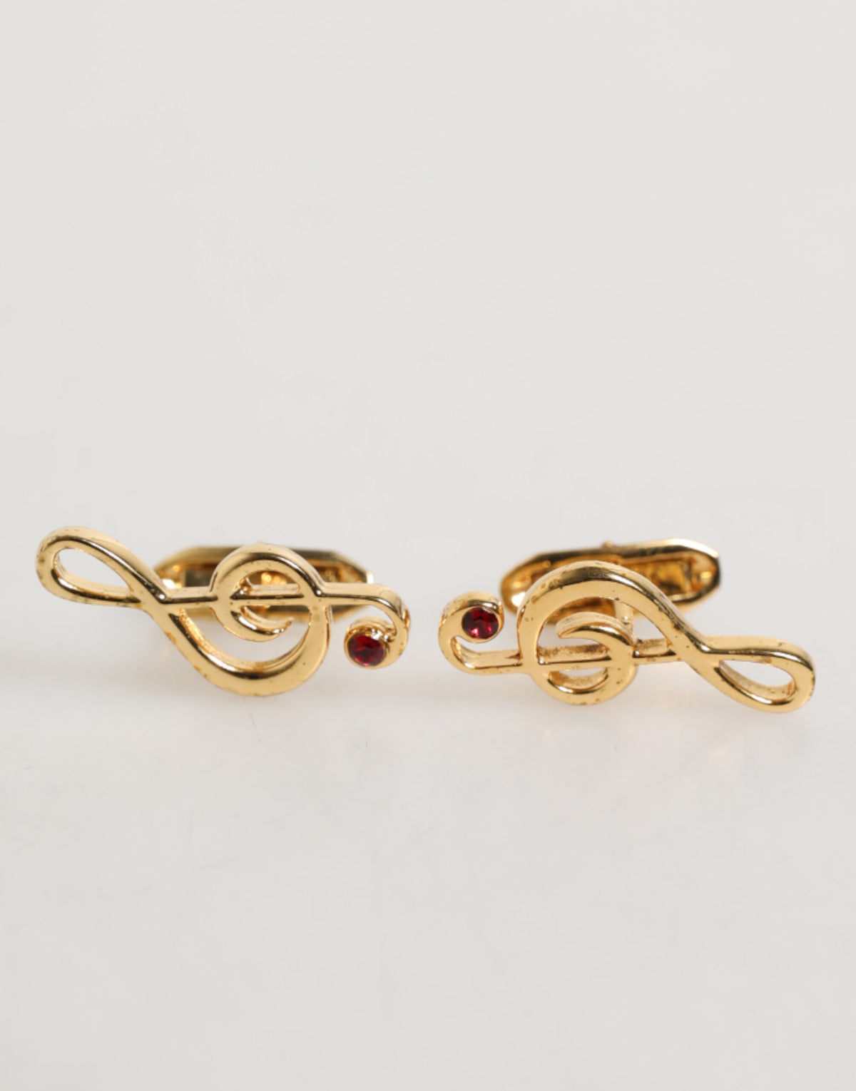 Épingle en laiton doré à motif de note de musique, accessoire pour homme, créateur Dolce &amp; Gabbana.
