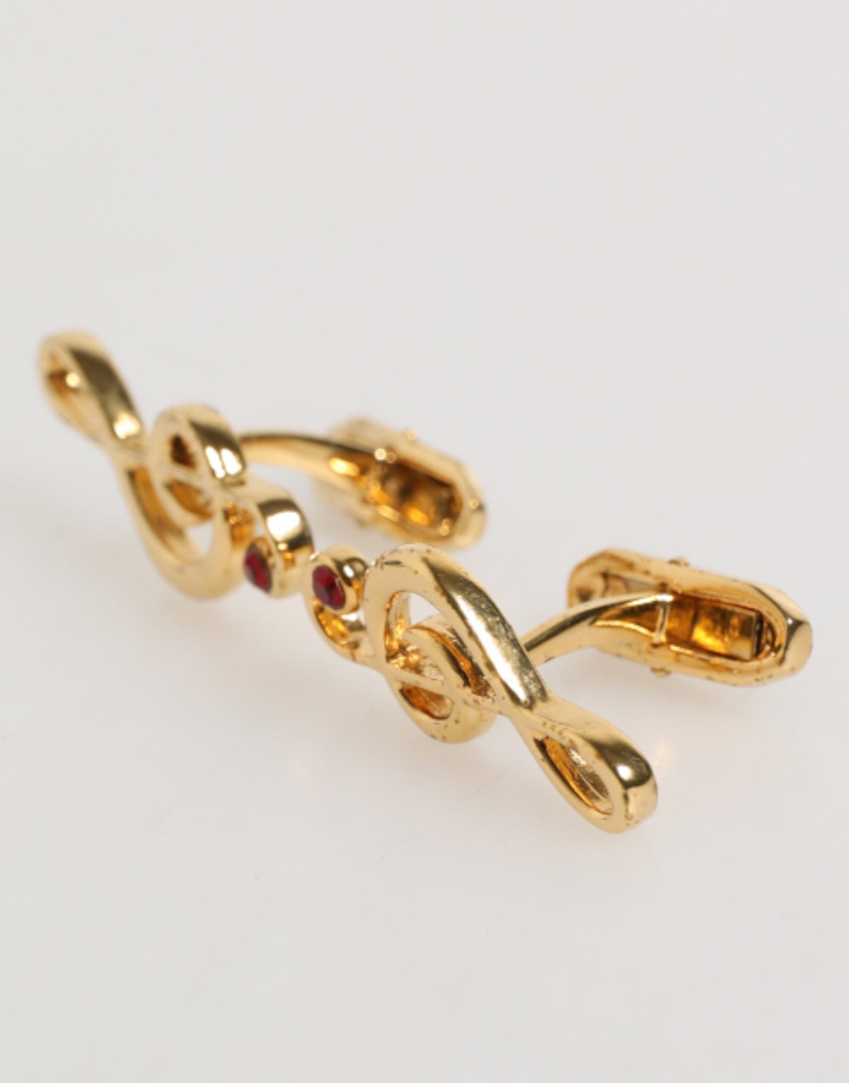 Épingle en laiton doré à motif de note de musique, accessoire pour homme, créateur Dolce &amp; Gabbana.