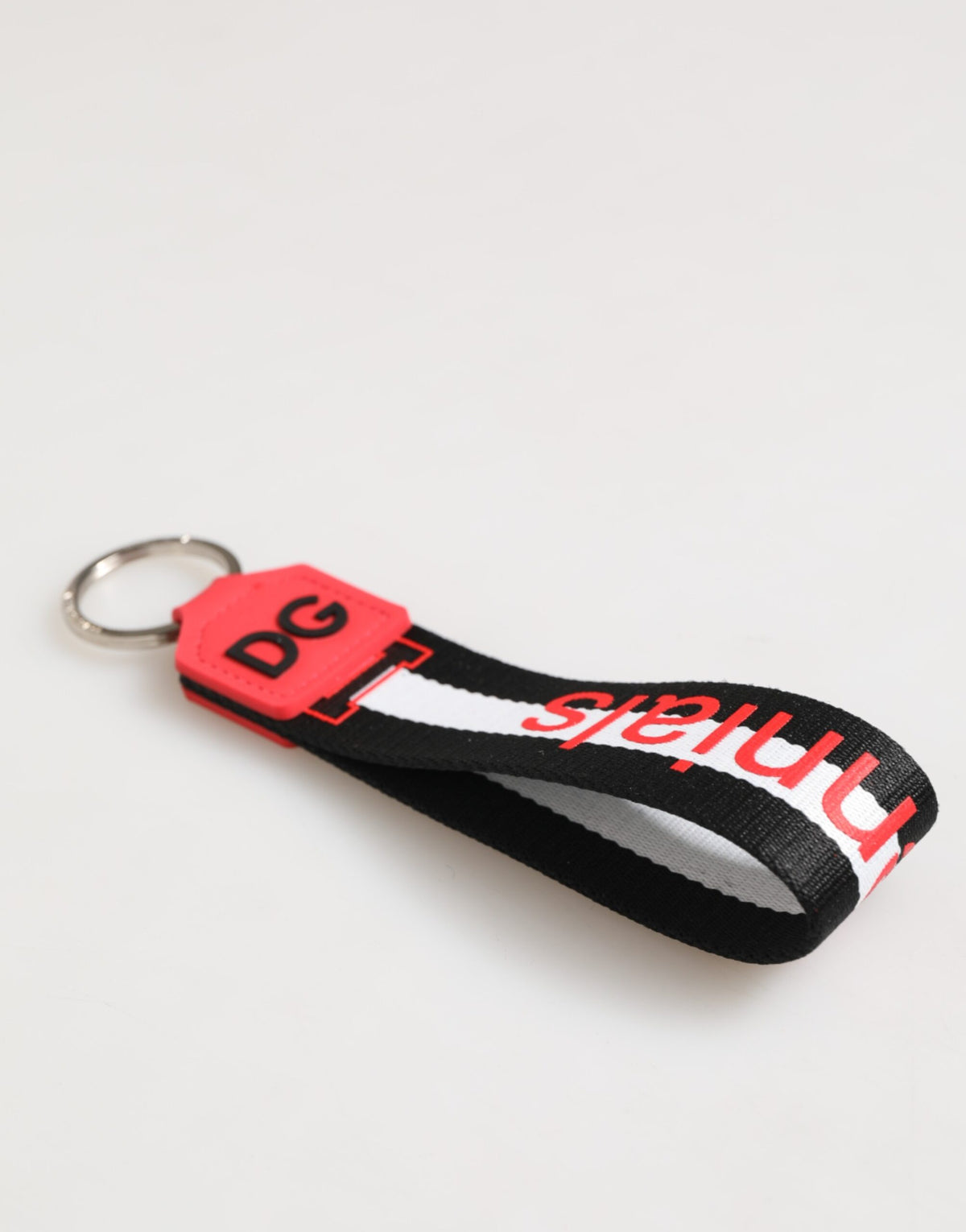 Porte-clés Dolce &amp; Gabbana en polyester et laiton avec logo DG rouge et blanc.