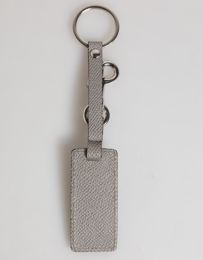 Dolce &amp; Gabbana sleutelhanger voor heren van grijs leer met logo en metalen ring.