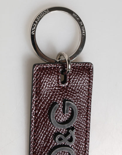 Porte-clés homme Dolce &amp; Gabbana en cuir marron foncé avec logo et anneau en métal.