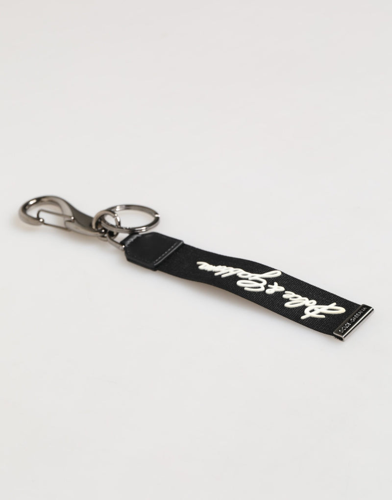Dolce &amp; Gabbana zwarte en witte polyester sleutelhanger met DG-logo en zilveren details voor heren.